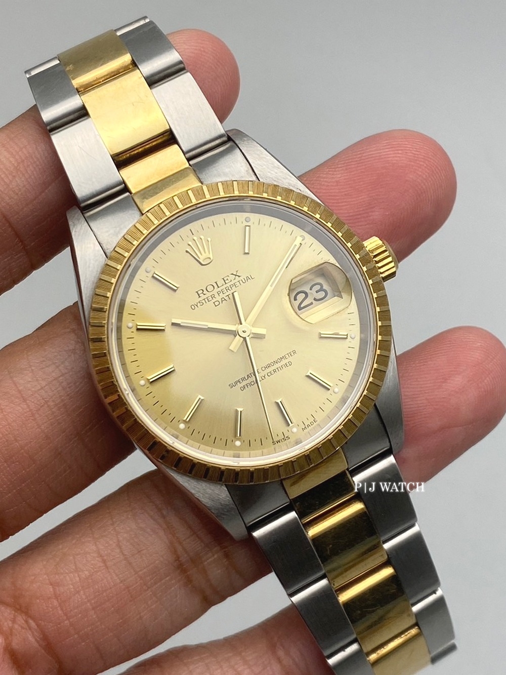 Rolex Oyster Perpetual Date 34mm Oyster Two-Tone Champagne Dial Ref.15223